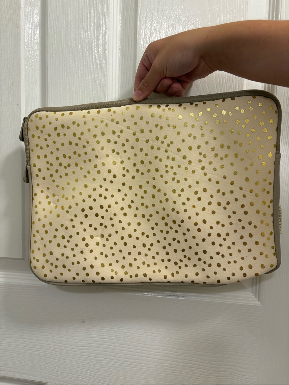 Dabney Lee laptop sleeve in the champagne gold polka dot pattern on cream
